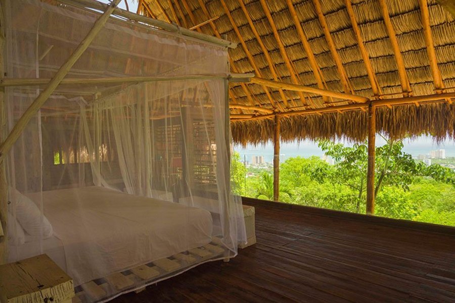 A comforting bed in one of the glamping cabins in Mamancana |Colombia Travel