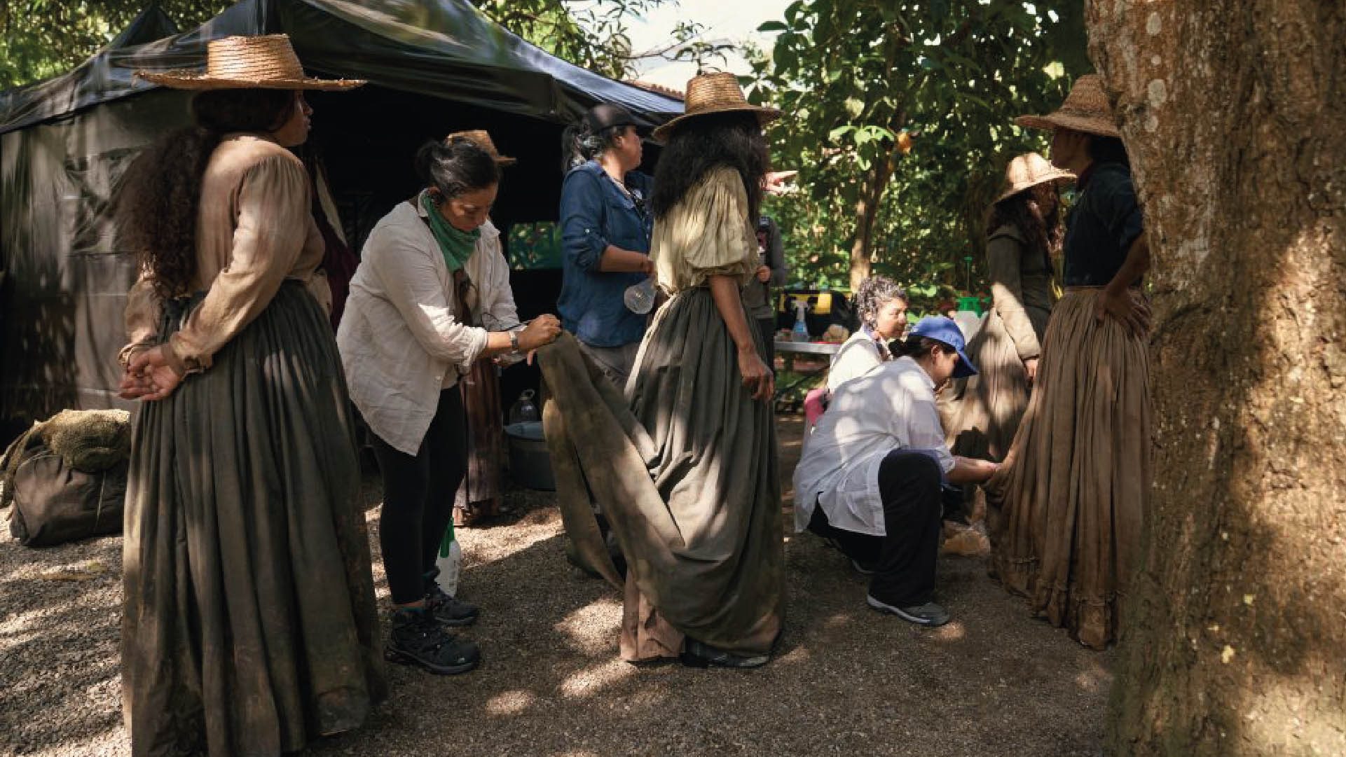 Actors from One Hundred Years of Solitude wearing costumes from a Colombian clothing brand