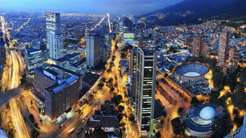 A bright aerial image of downtown Bogotá at sunset. Discover business tourism in the capital.