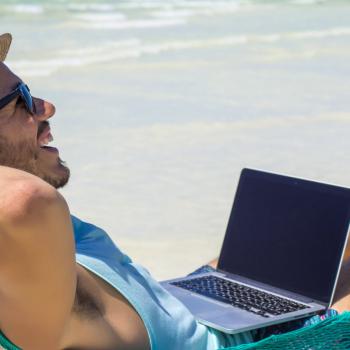 Digital Nomad working at the beach.
