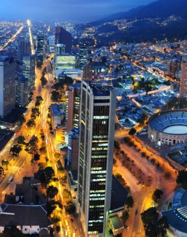 Panoramic view of Bogotá with buildings, eastern hills, and clear skies